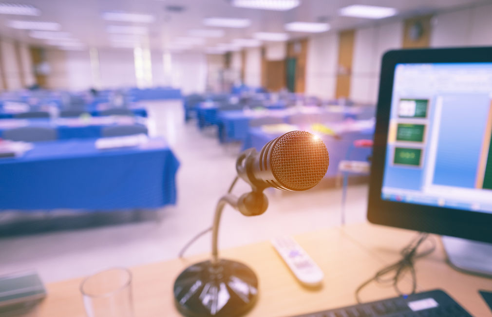 Microphone on the table with computer in