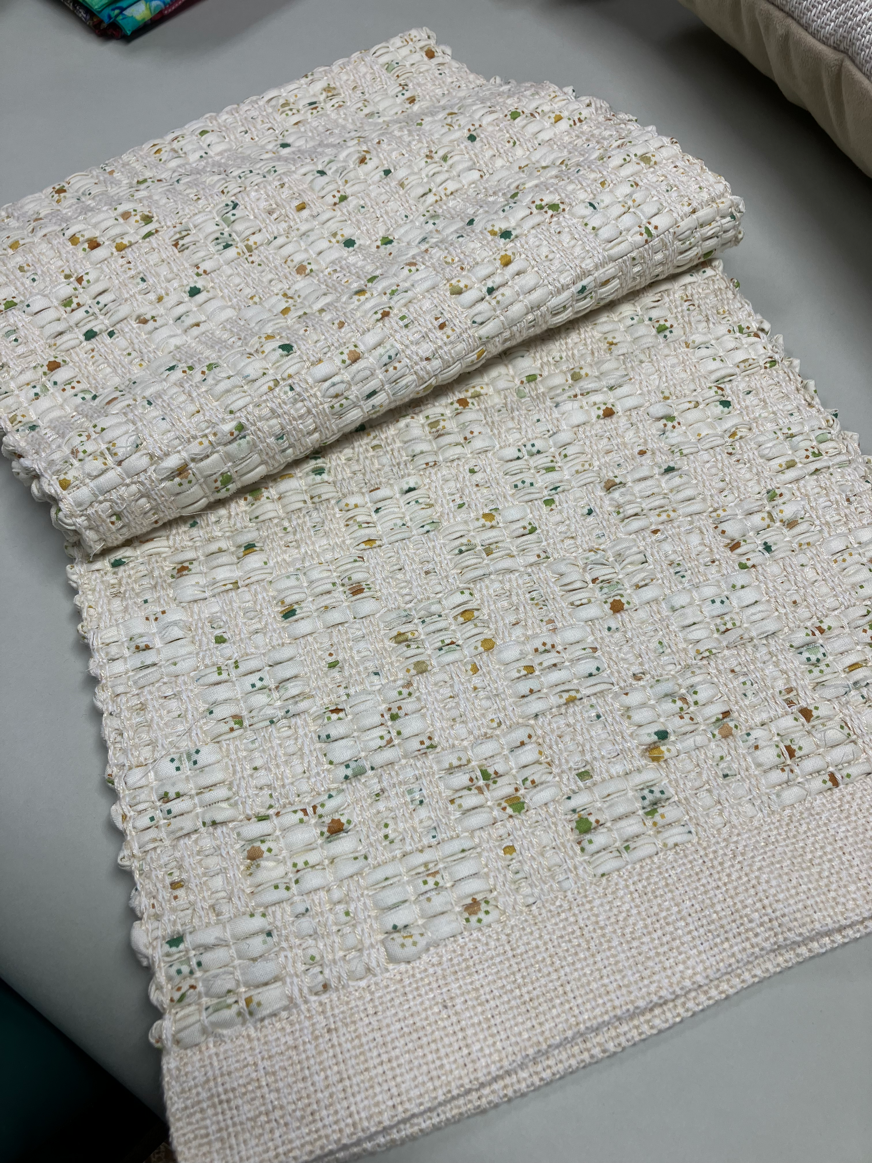 Close-up of white woven textile with colorful flecks, Right Turn by Virginia Fauvre