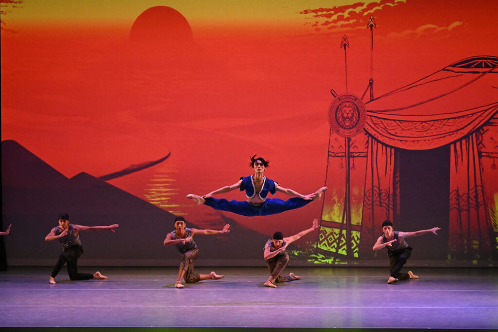 Dancers from Arts Ballet Theatre of Florida (ABTF) in Polovetsian Dances, choreographed by Vladimir Issaev, with Ataru Matsuya airborne in the center. (Photo by @patriciasphotography, courtesy of ABTF).