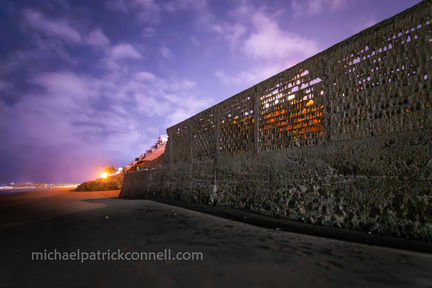 Protective wall battered by the surf.