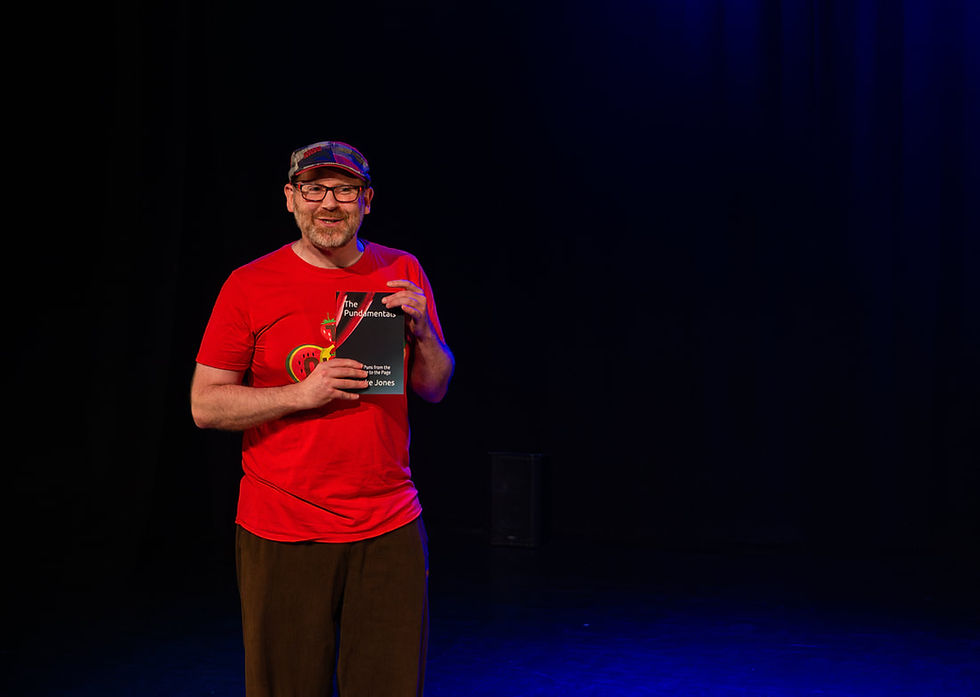 A picture of Iain Luke Jones holding a copy of his book 'The Pundamentals' whislt shamelessly self-promoting it.