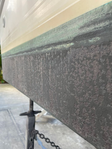 Boat waterline before antifoul preparation