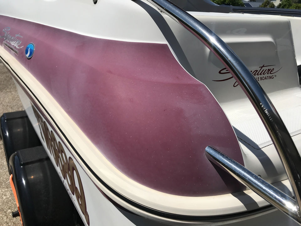 oxidised red gelcoat on a trailer boat