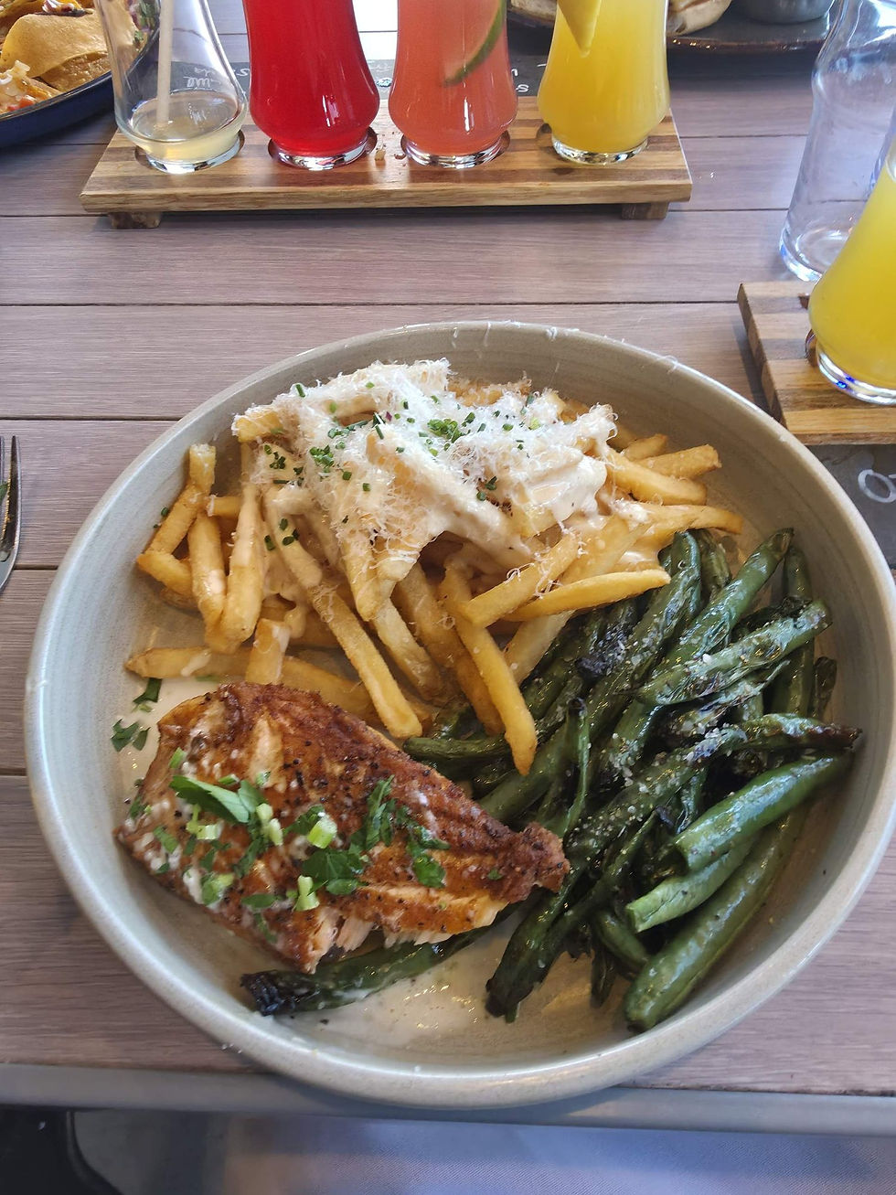 Salmon with truffle cheese fries and green beans at Eureka! Henderson