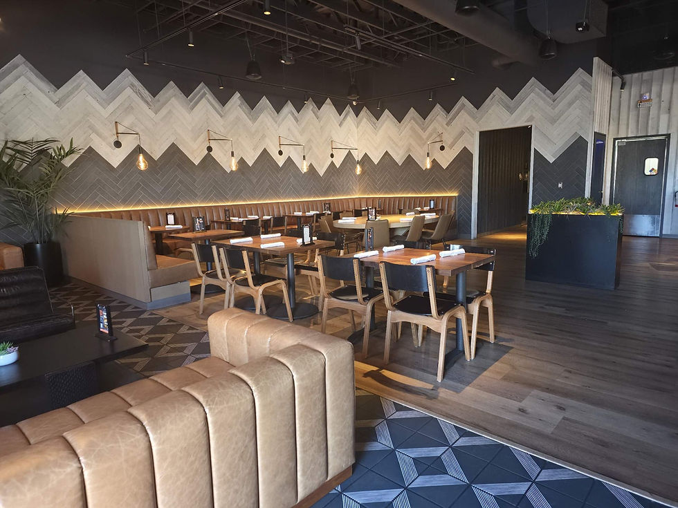 Eureka! Henderson dining room with leather booths and a chevron wood wall