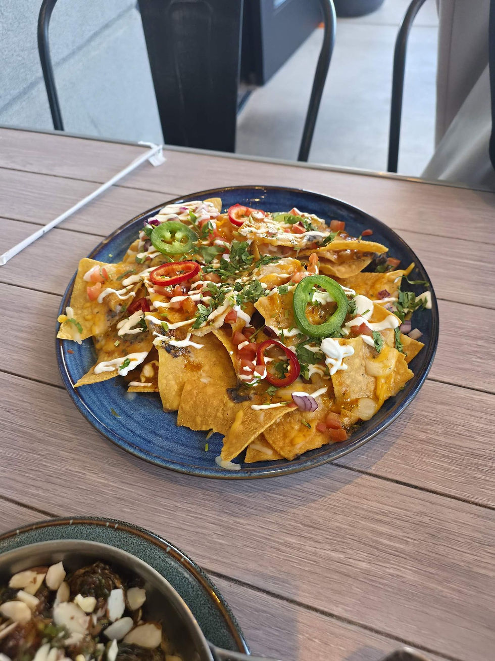 Nachos with jalapeños, Fresno chiles, crema and cilantro at Eureka! Henderson