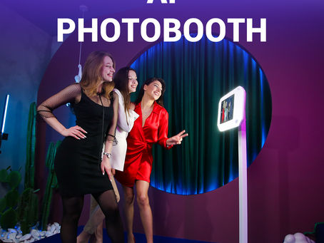 Three stylish young women posing for a high-tech "AI Photobooth" with a glowing ring light and interactive screen in a vibrant event space with deep purple and teal accents.