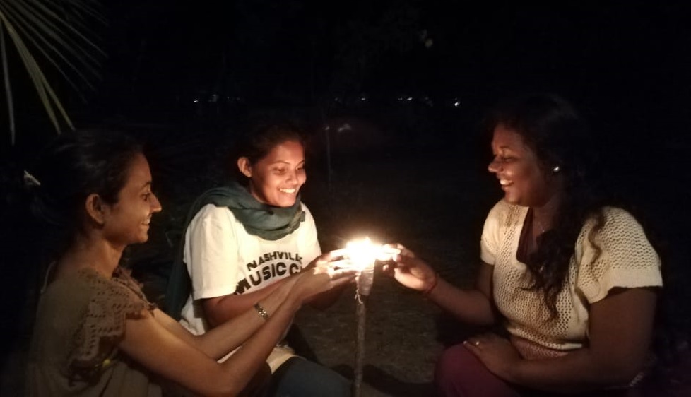 Indunil, Shalini akka and myself lighting clay lamps