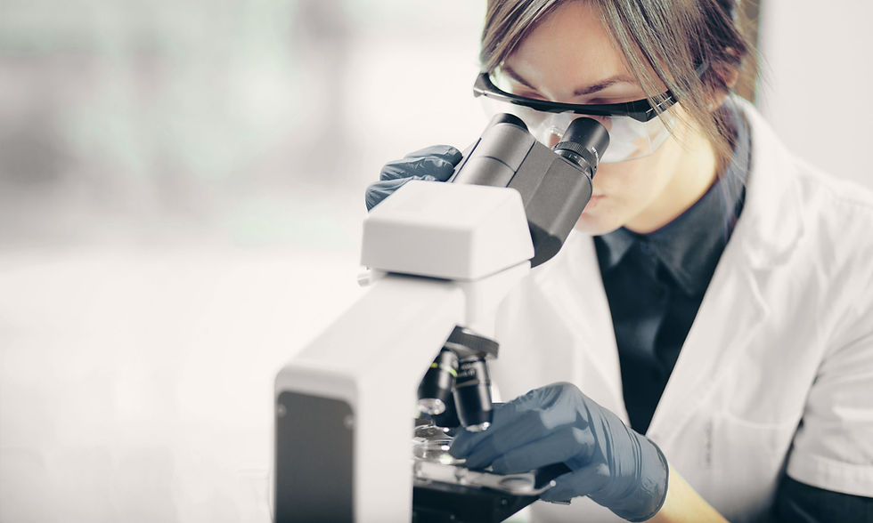 Scientist Using Microscope