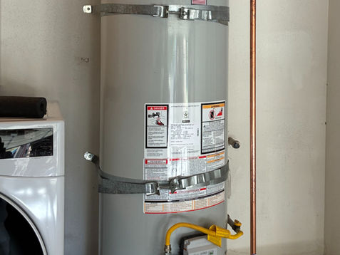 Newly installed 40-gallon Bradford White gas water heater in a San Juan Capistrano utility room