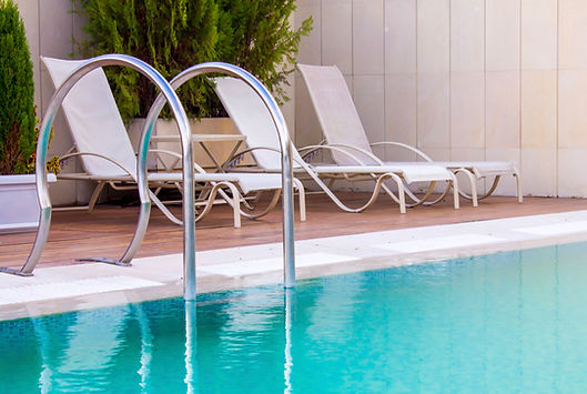 Pool chairs on side of pool