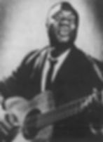 Promotional photo of Tedd Browne singing and playing guitar, circa 1965.