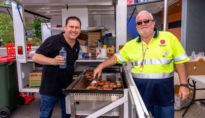 Gladstone Mayor Matt Burnett (left) enjoys a conversation with Mick Evans, Community Engagement Officer for Gladstone Corps, at the barbecue set-up at the Philip Street Precinct.