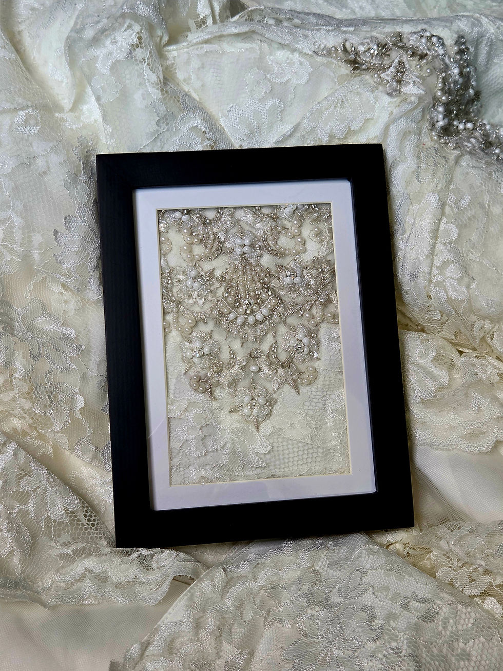 Thumbnail: This handcrafted frame is designed to showcase wedding dress fabric and photos, creating a unique bridal keepsake.