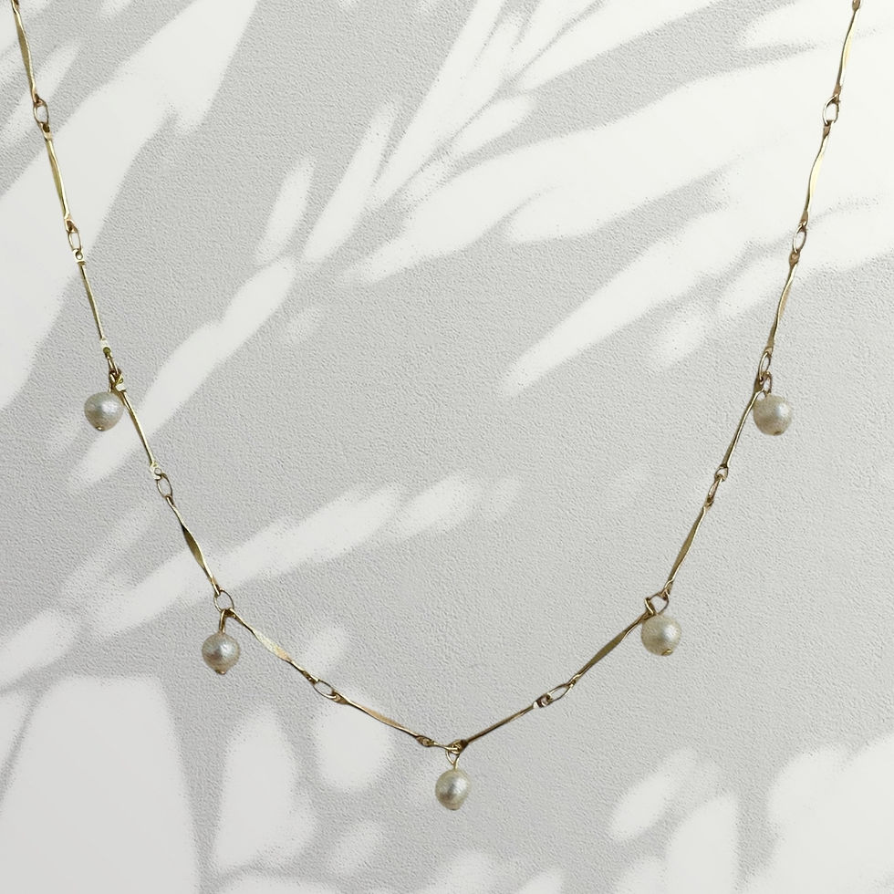 Thumbnail: Gold necklace with pearl drops on flat bar link chain. Elegant, lightweight design for everyday wear or minimalist layering.