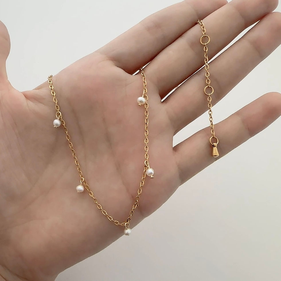 Thumbnail: Tarnish-free gold necklace with pearl charms on cable chain. Lightweight, elegant design for layering or everyday styling.