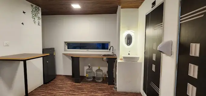 Interior view of a modern bathroom with a sink and mirror.