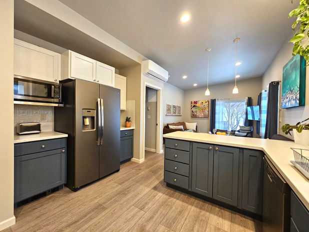 Modern kitchen in a Sunflower Resort cabin, Winthrop, Washington, featuring a large refrigerator, full appliances, and ample counter space