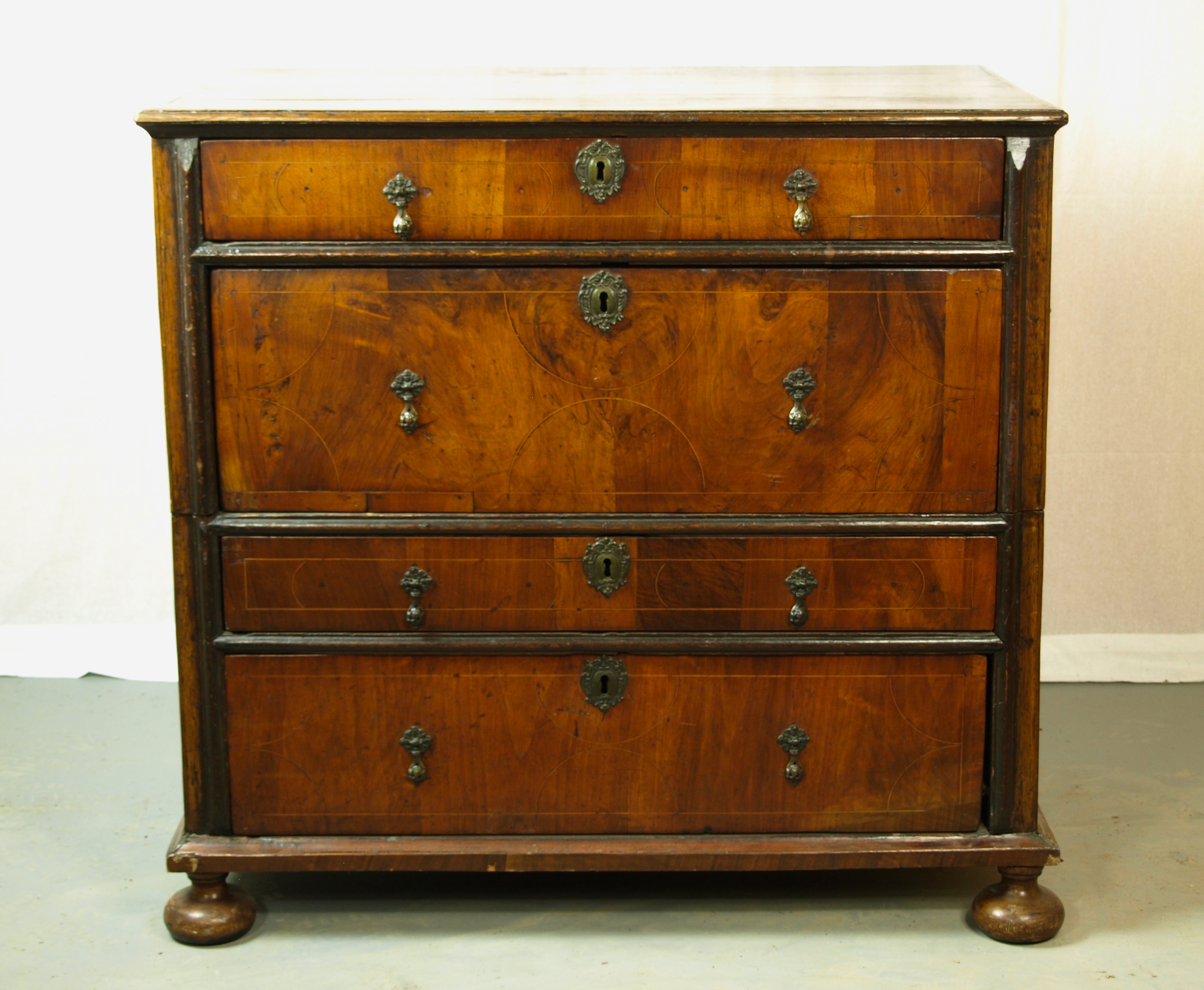 WALNUT VENEERED CHEST OF DRAWERS