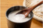 Sakekasu in a small bowl is stirred with a spoon