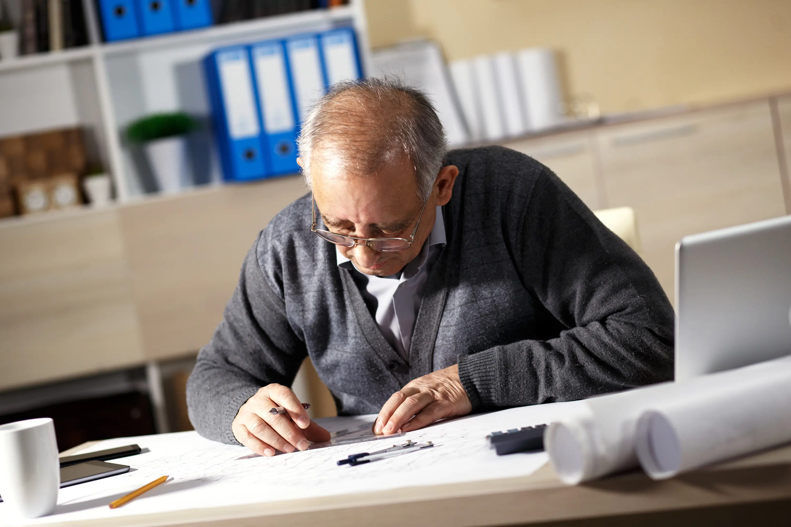 elderly-man-working.webp