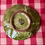 Thumbnail: little green saucer with shell