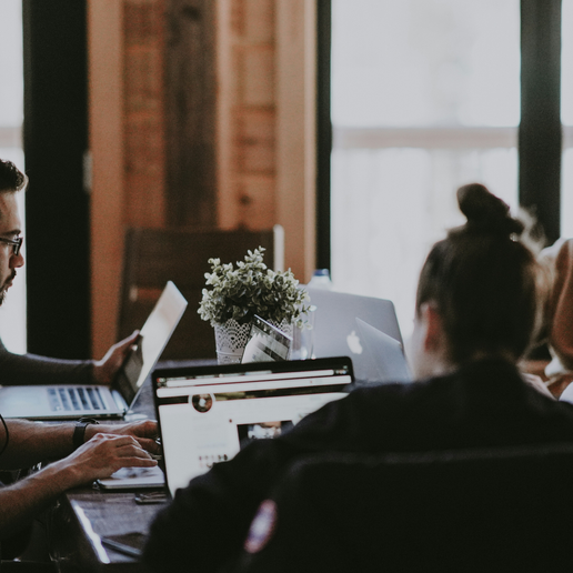 Team working together on how to structure a pitch that captivates.