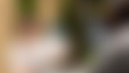 A woman holding a paper telling how to write a business proposal letter for funding.