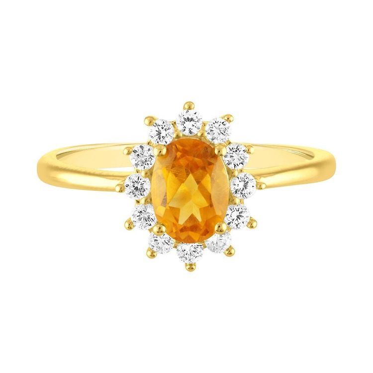 oval citrine and diamond halo yellow gold ring on a white background