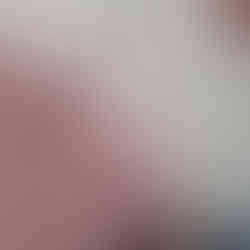 Cutaway Poncho in cream fine fluffy yarn with peach coloured fowers and green leaves across the chest