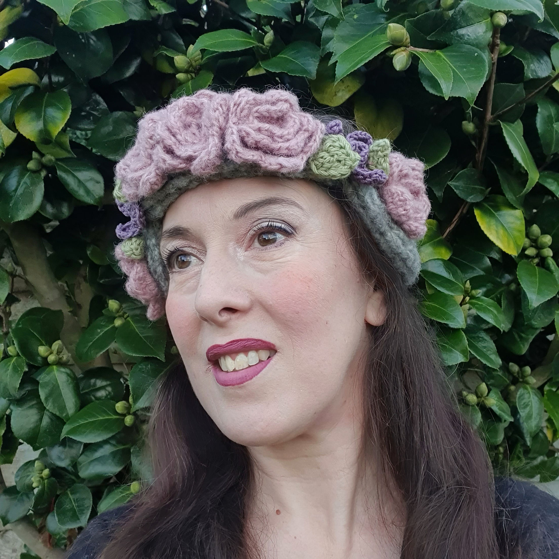 Rose and Violet Creams Set grey headband with pink fluffy flowers, smooth purple flowers and small green leaves in grochet