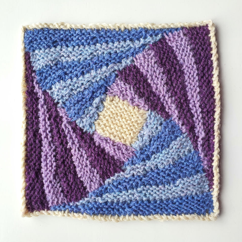 blue and purple knitted square with striped twirling appearance