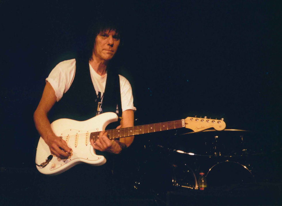 Jeff Beck playing stratocaster on stage