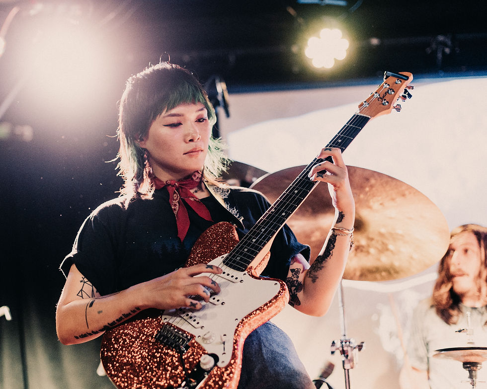 Yvette Young playing guitar in concert