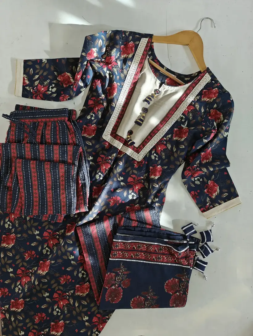 A kurti featuring custom latkan designs on the placket and personalized potli work on the dupatta.