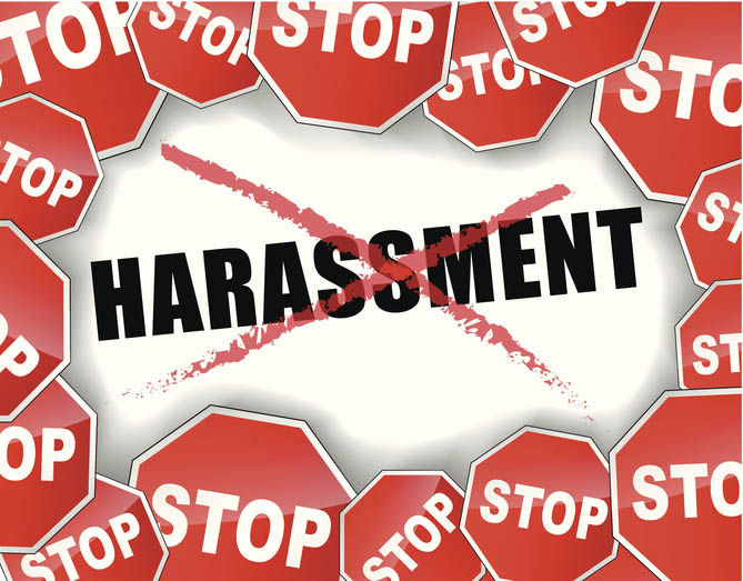 Word 'harassment' in the middle being crossed out