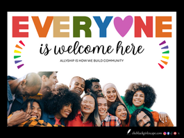 A diverse group of smiling people, including Black, Asian, Middle Eastern, and white individuals, pose closely together in a joyful, supportive embrace. Above them, bold rainbow-colored text reads “EVERYONE is welcome here” with a heart replacing the “O.” Below the text, a tagline says “ALLYSHIP IS HOW WE BUILD COMMUNITY.” Colorful rainbow arcs frame the left and right sides of the image.