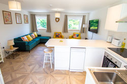 Open Plan Area with TV and Breakfast Bar