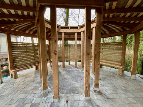 Wood hexagon with open center to connect with Nature while still protected under shelter