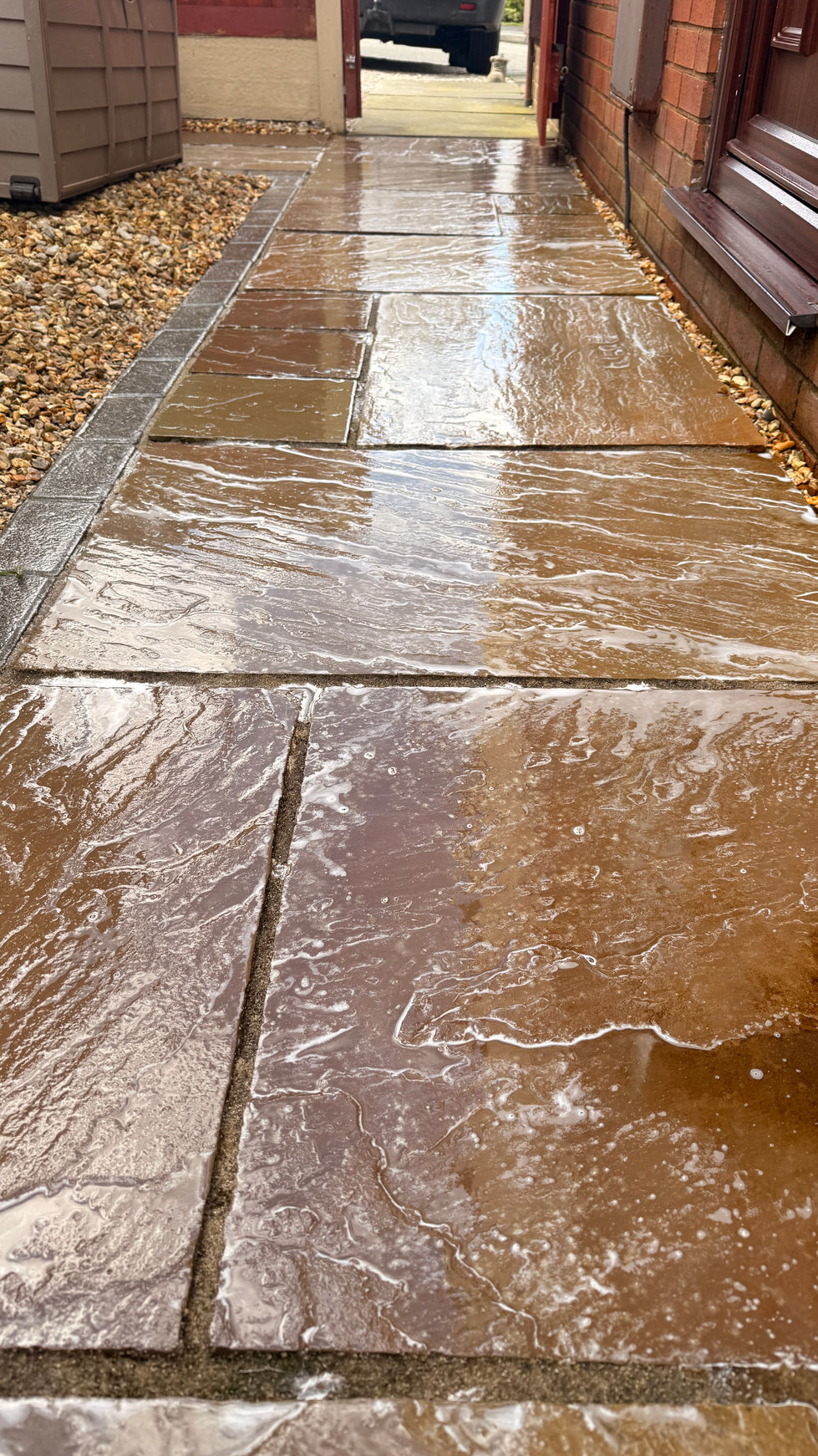 Professional patio cleaning treatment on paving slabs in Flintshire