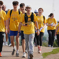 Shani's mum, sister and brother (pictured with his friends) all walked 20 miles.jpg