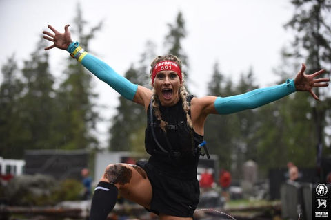 Tiffany leaping during a marathon.