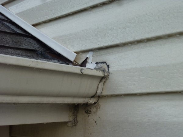 Damaged gutter flashing needs repair