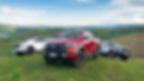 Three Toyota Hilux pickups parked outdoors