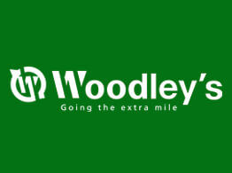 Woodley's logo, Going the extra mile, white text on a green background.