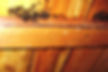 Numerous dark insects on wooden beams