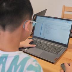 Student learning about Python basics in our Introduction to Python class (Suitable for Ages 10-12)