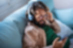 Person smiling on a couch