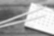 Drumsticks and calendar on a table
