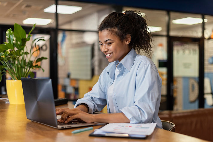 side-view-smiley-woman-working-with-laptop-office.jpg